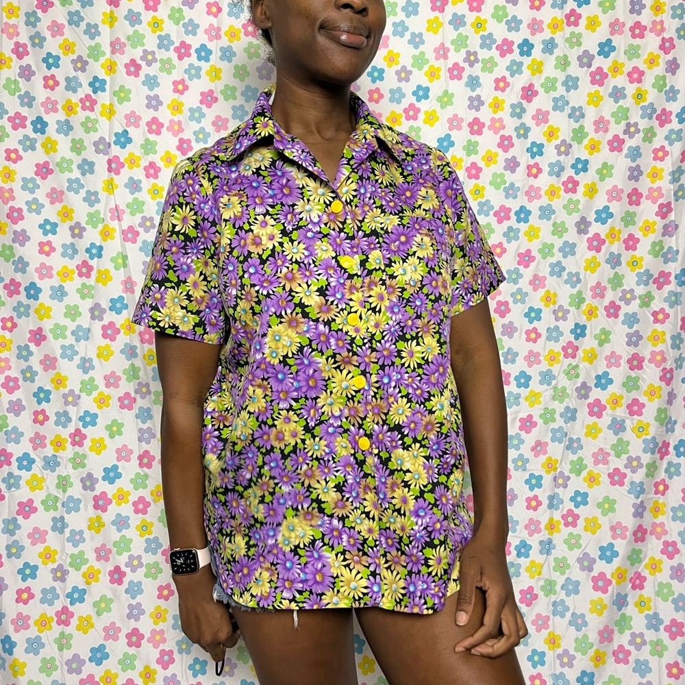 Purple and yellow floral button up. Soft and lightweight. Fits like a M/L.